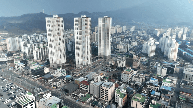 Cityscape with high-rise buildings and mountains