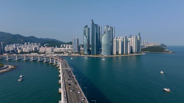 Busan cityscape with modern high-rise buildings, Gwangan Bridge, and the ocean