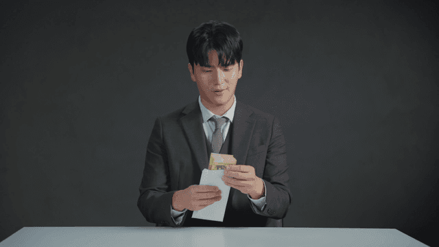 Man counting money inside an envelope