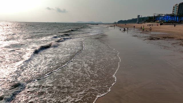 Waves crashing on a sandy beach
