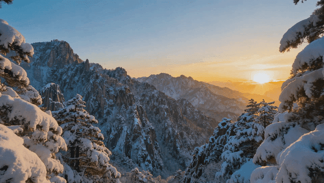 Snow-covered mountains at sunrise