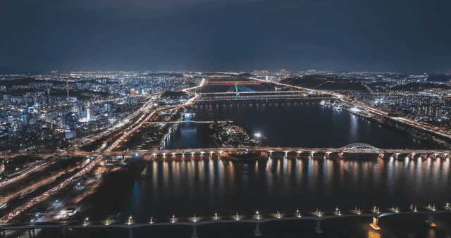 Vibrant city landscape with illuminated bridge