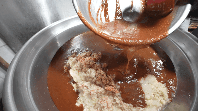 Seasoning poured into large pot