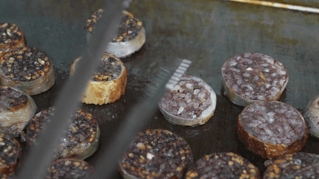Grilling makchang sundae on griddle