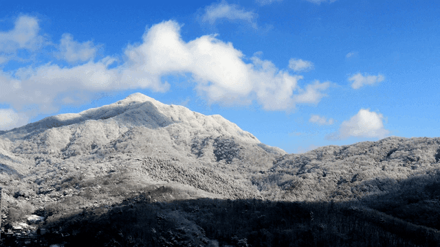 Snow-covered mountain under a clear blue sky