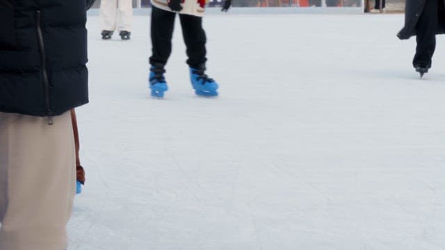 People ice skating on a rink