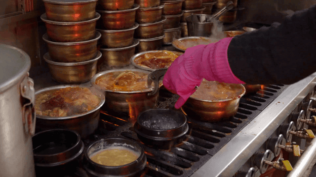 Kimchi stew boiling on a stove