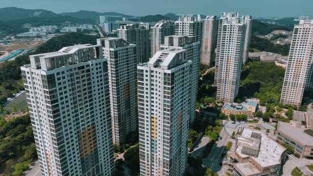 High-rise apartments surrounded by greenery