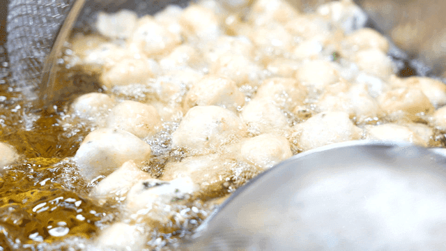 Round fish cakes fried in hot oil