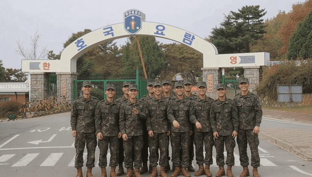 Soldiers waving in front of army training camp