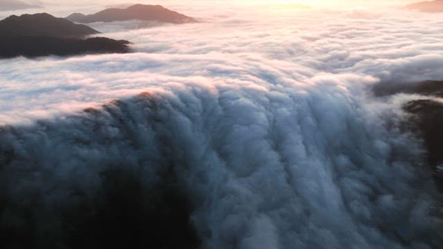 Clouds over mountain peaks