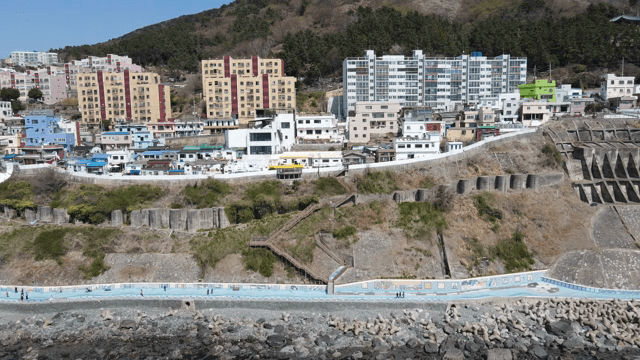 Colorful coastal village with hillside houses