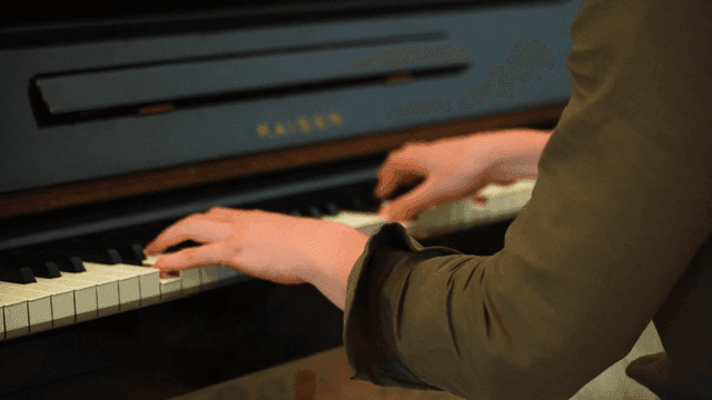 Hands playing classical piano