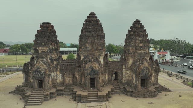 Overview of a Bustling Street with Ancient Temple Ruins