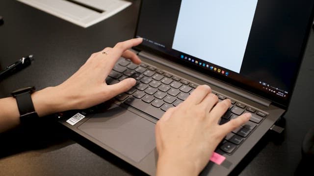 Hands of a Professional Working on a Laptop