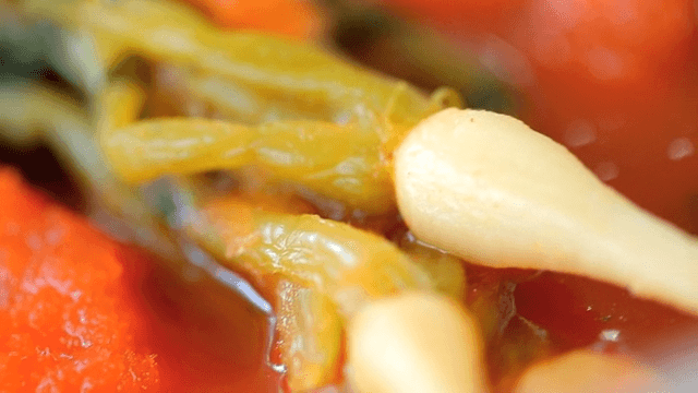 Close-up of yeolmu kimchi with red sauce