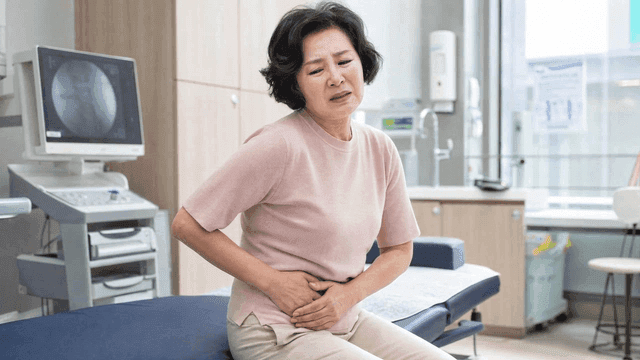 Elderly female patient with abdominal pain at clinic