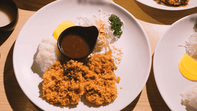 Plate of Western-style pork cutlet, rice, and salad