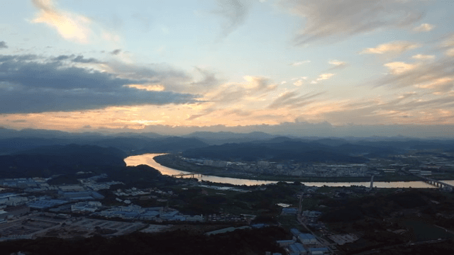 River flowing through the village and sunset