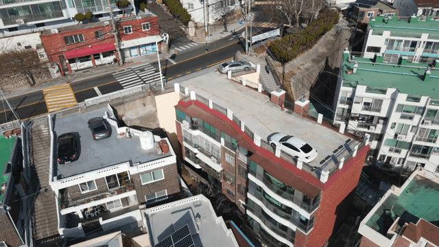 Aerial view of city building rooftops and streets