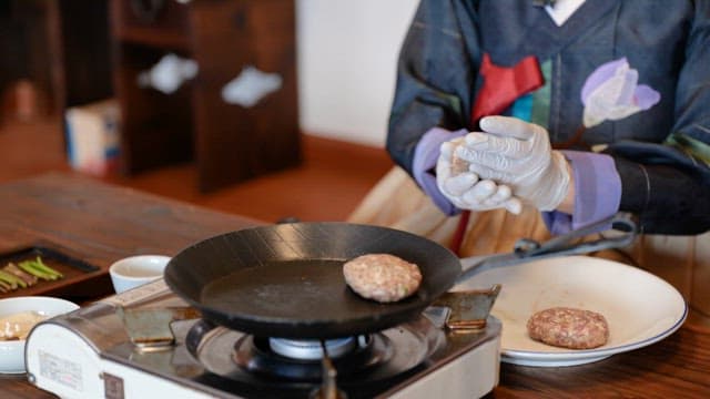 Woman Wearing Hanbok Cooking Tteokgalbi