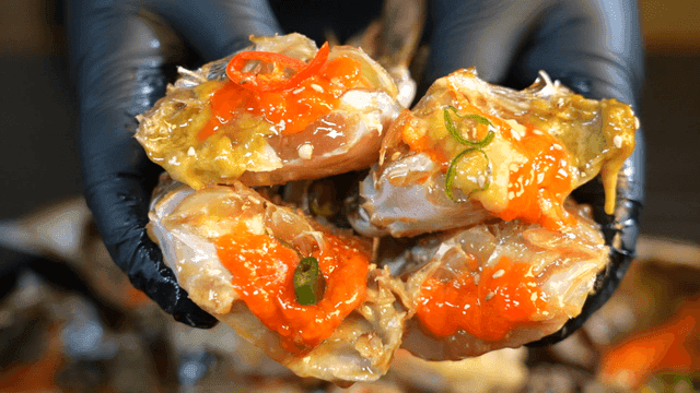 Cross-section of soy sauce marinated crab full of roe and meat
