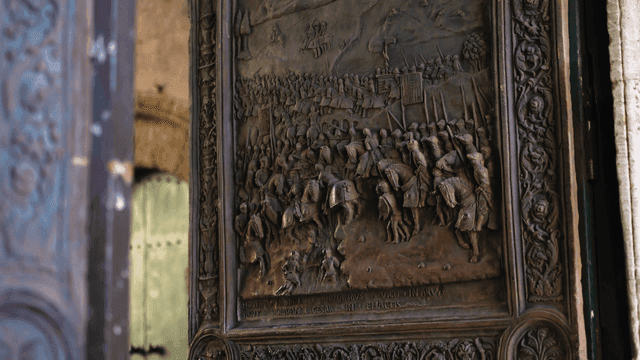 Intricate carvings on a large wooden door