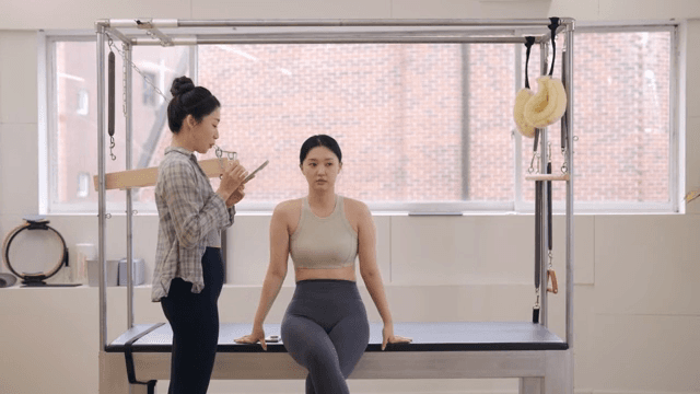 Two women discussing in a fitness studio