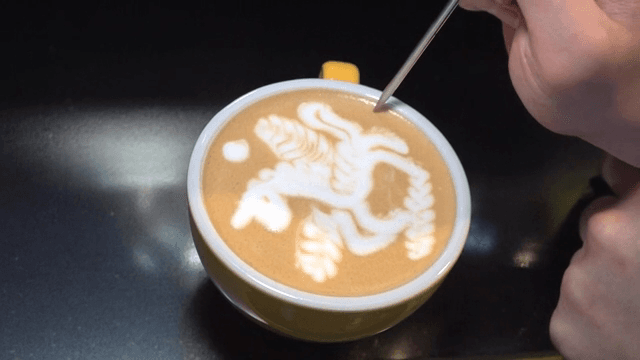 Latte art with a unicorn design in a cup