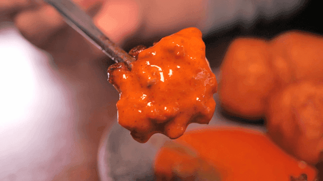 Octopus legs dipped in spicy sauce