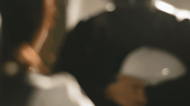 Back view of woman smiling at construction worker