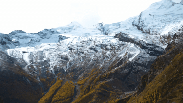 Profile of woman looking at snow-covered mountain
