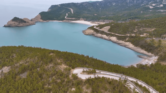 Serene coastal landscape with winding roads