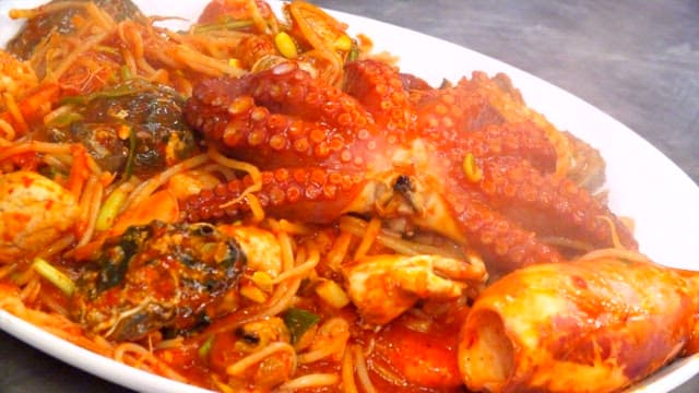 Spicy braised spicy seafood dish with octopus and abalone