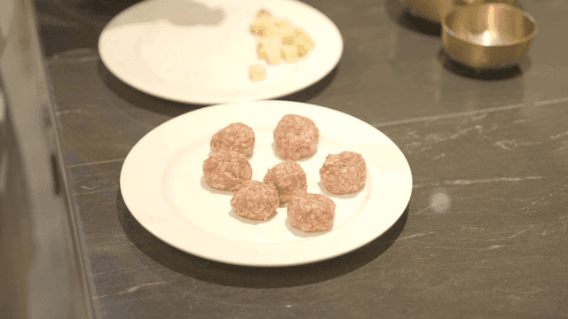 Meatballs prepared on a kitchen counter