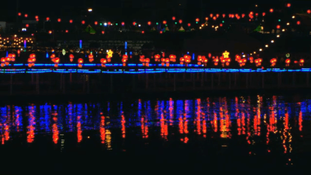 Colorful festival lights reflected in the river