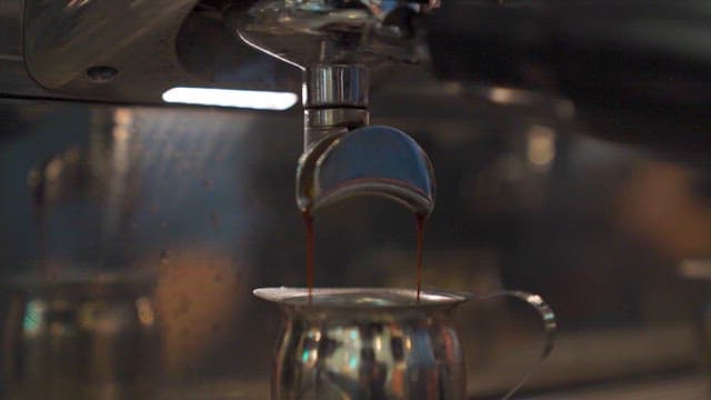 Fresh coffee being brewed in machine