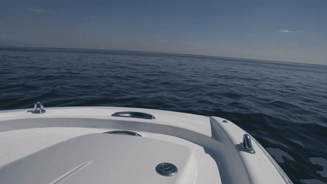 Yacht sailing on calm sea.