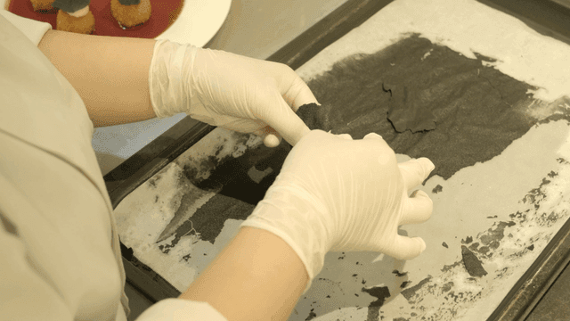 Hands preparing food with precision