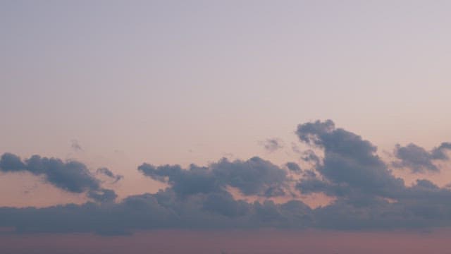 Serene Twilight Sky with Soft Clouds