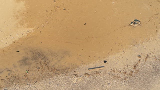 Quiet Beach with Foam of Wave Rolling in