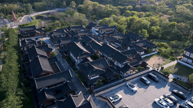 Hanok village surrounded by green trees
