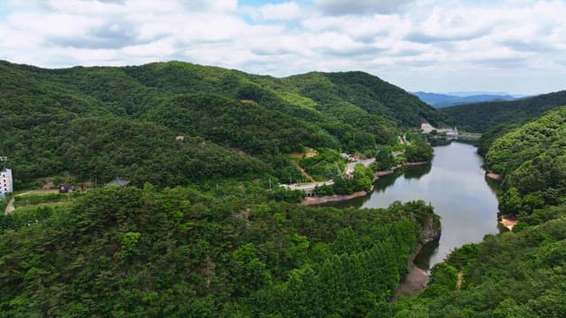 Green mountains with a tranquil river