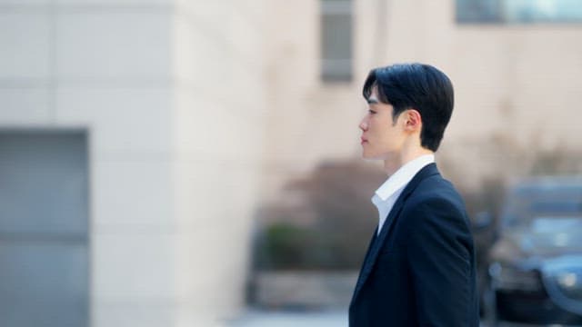 Man with a briefcase entering the building