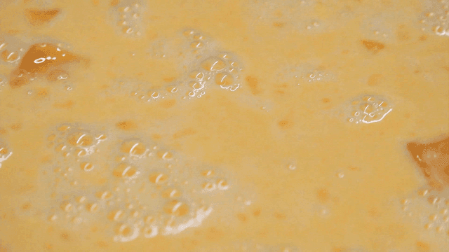 Foamy blended egg mixture rising bubbles