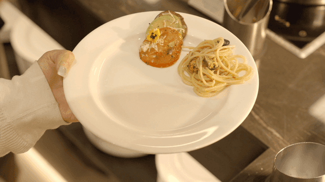 A plate with pasta and vegetables