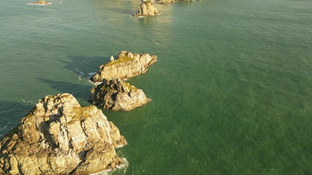 Rocky island surrounded by calm sea