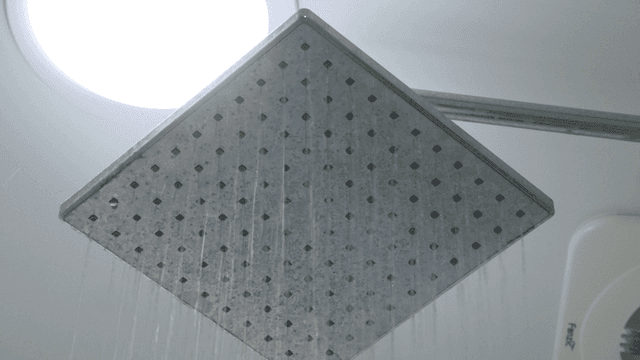 Water flowing from a shower head