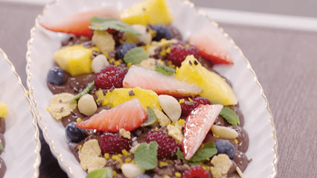 A colorful fruit-topped chocolate dessert