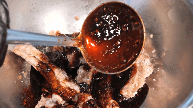 Sauce poured over fried ribs